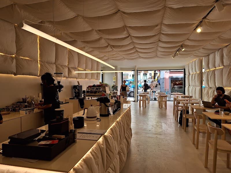 The Folks Santos interior with metallic ceiling and people gathered at tables